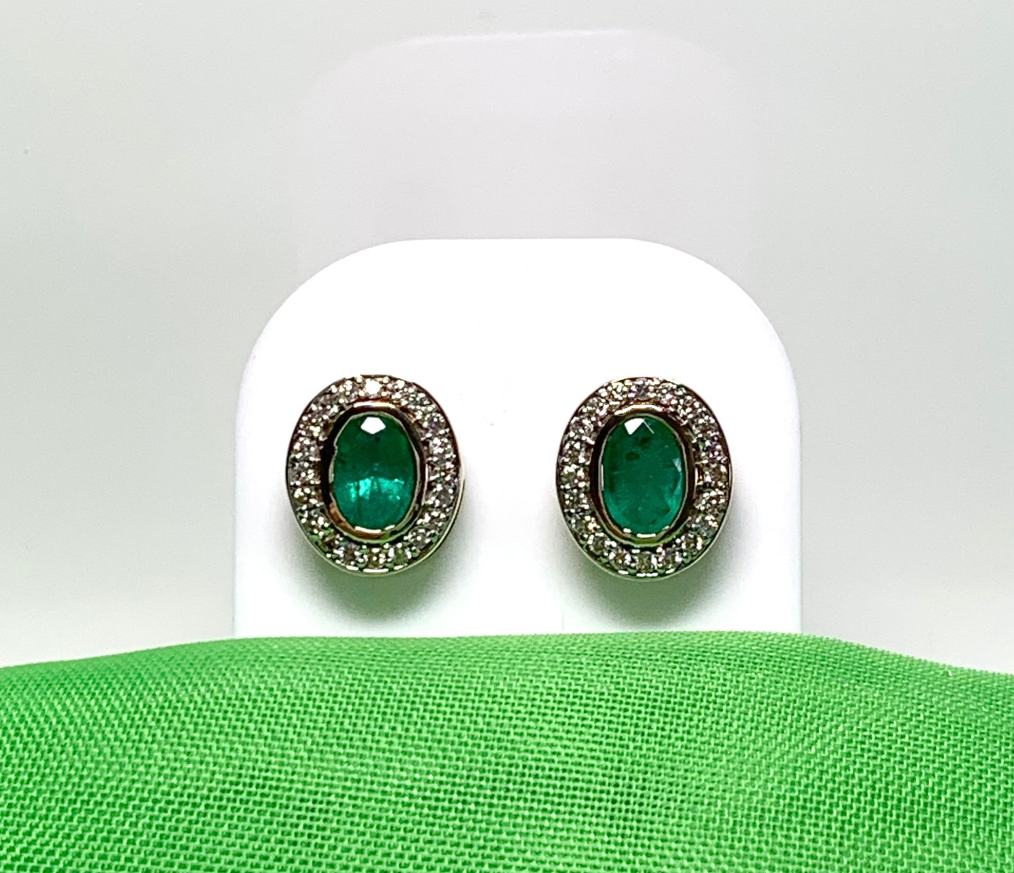 Real green emerald and diamond yellow gold oval cluster stud earrings