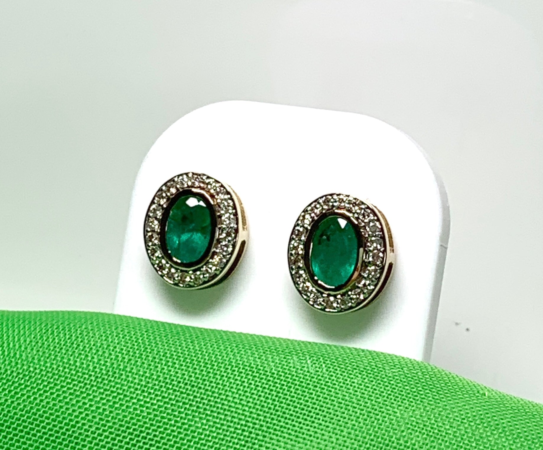 Real green emerald and diamond yellow gold oval cluster stud earrings