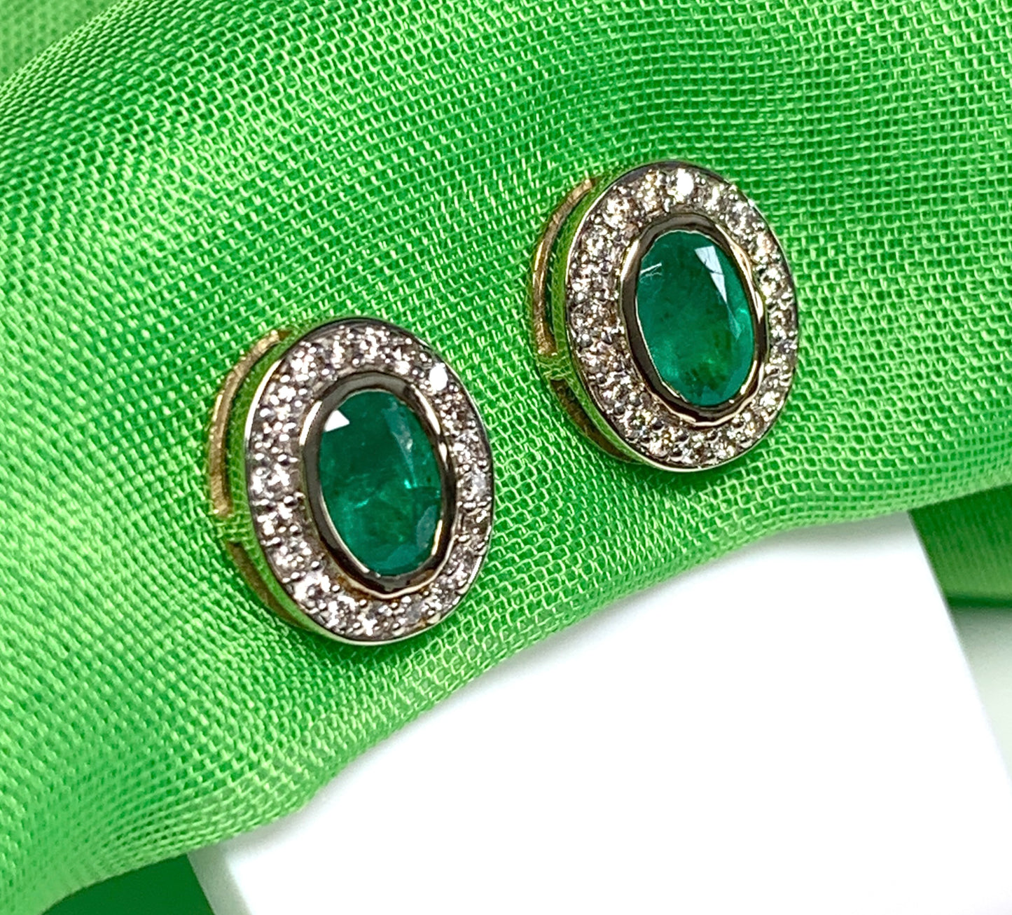 Real green emerald and diamond yellow gold oval cluster stud earrings