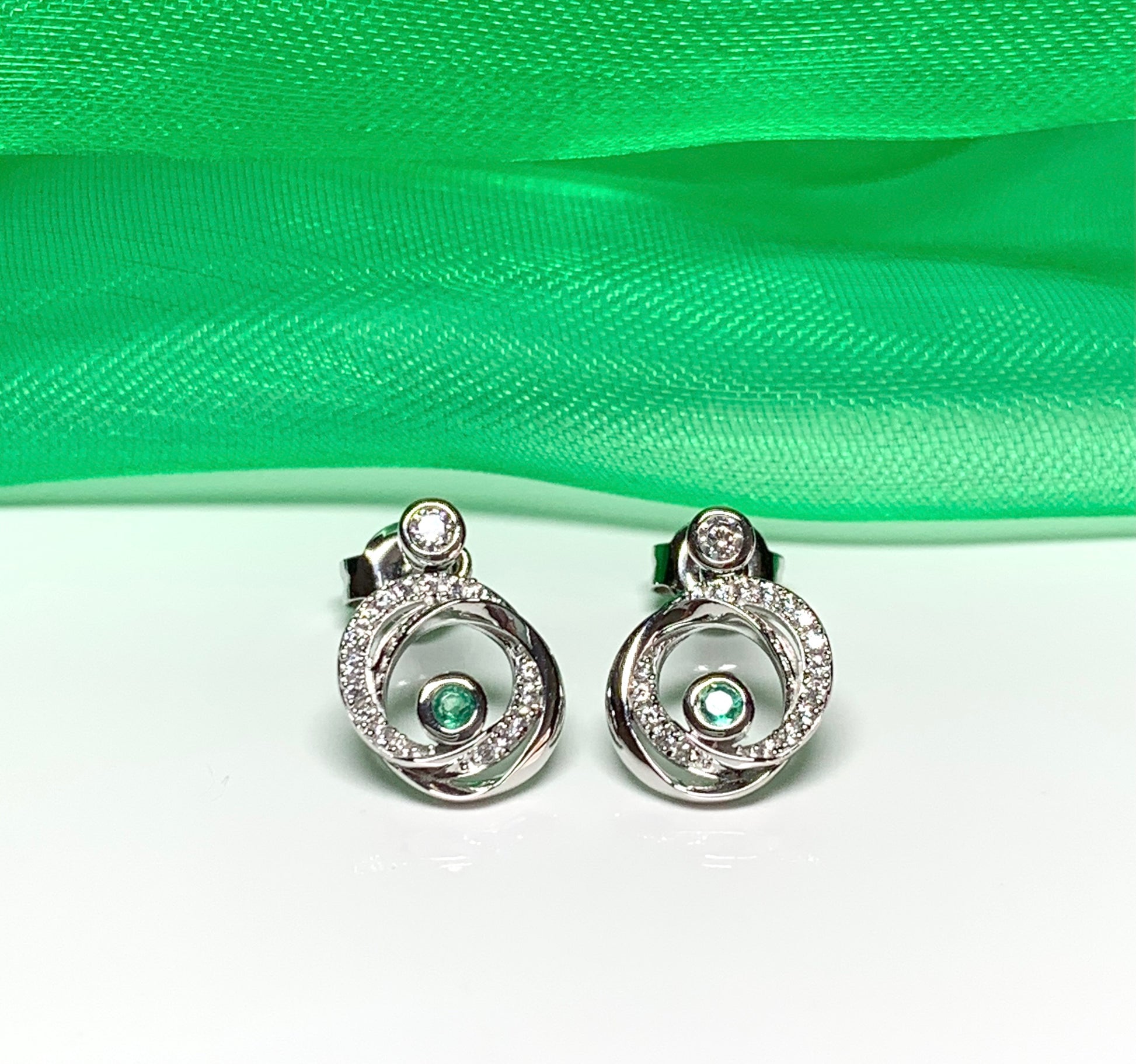 Real green emerald and cubic zirconia round swirl stud earrings