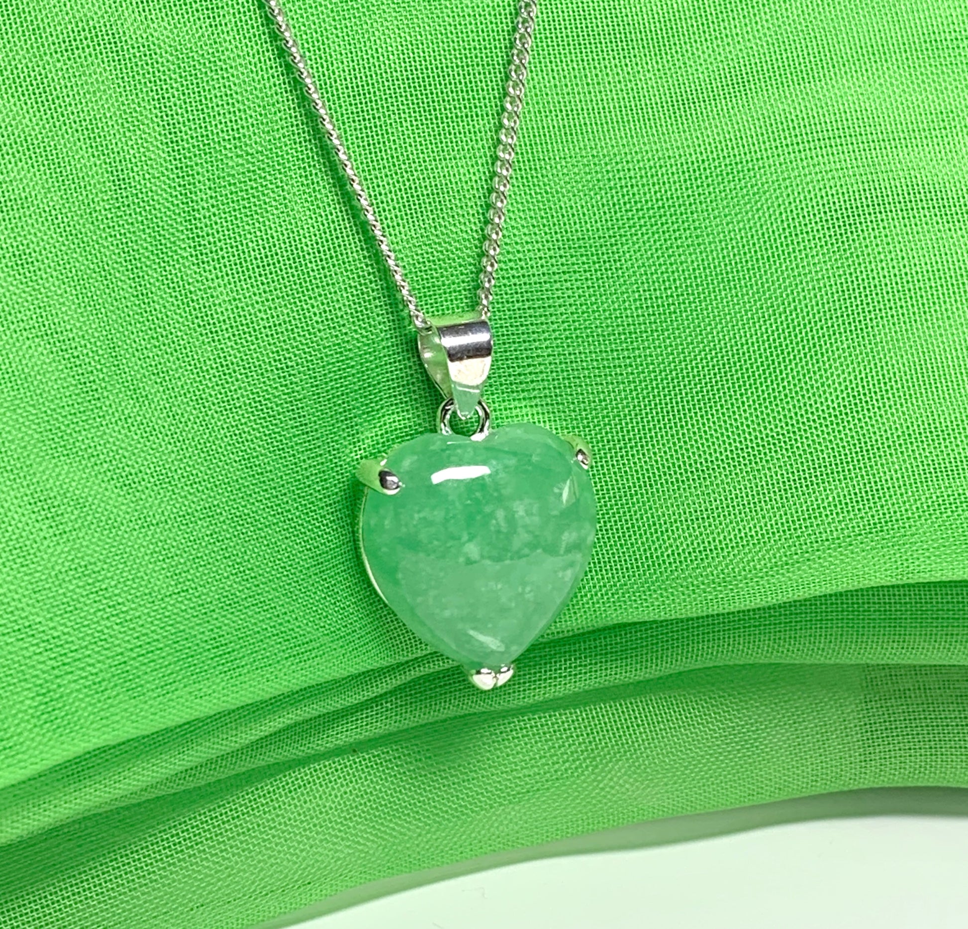 A real green jade necklace heart shape sterling silver pendant