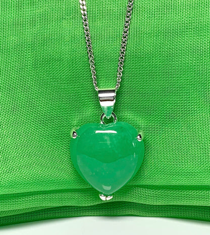 A real green jade necklace heart shape sterling silver pendant including chain