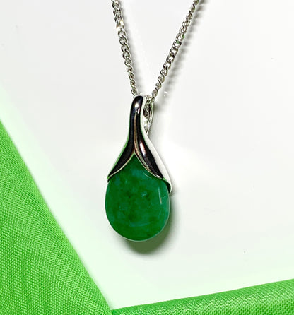 Real green jade necklace in a pear or tear drop shaped sterling silver pendant