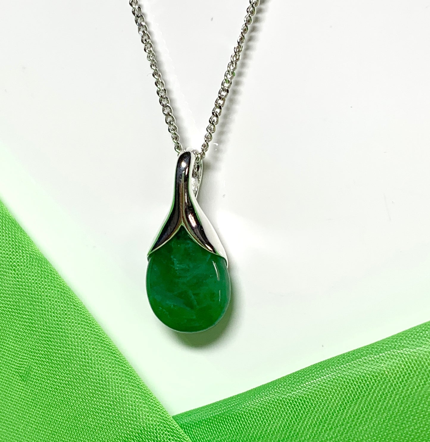 Real green jade necklace in a pear shaped sterling silver pendant