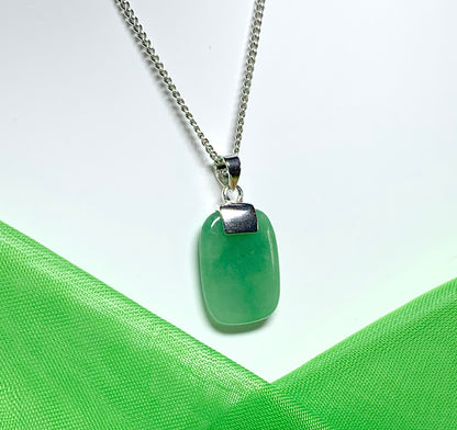 Necklace having a real green jade sterling silver cushion shaped pendant