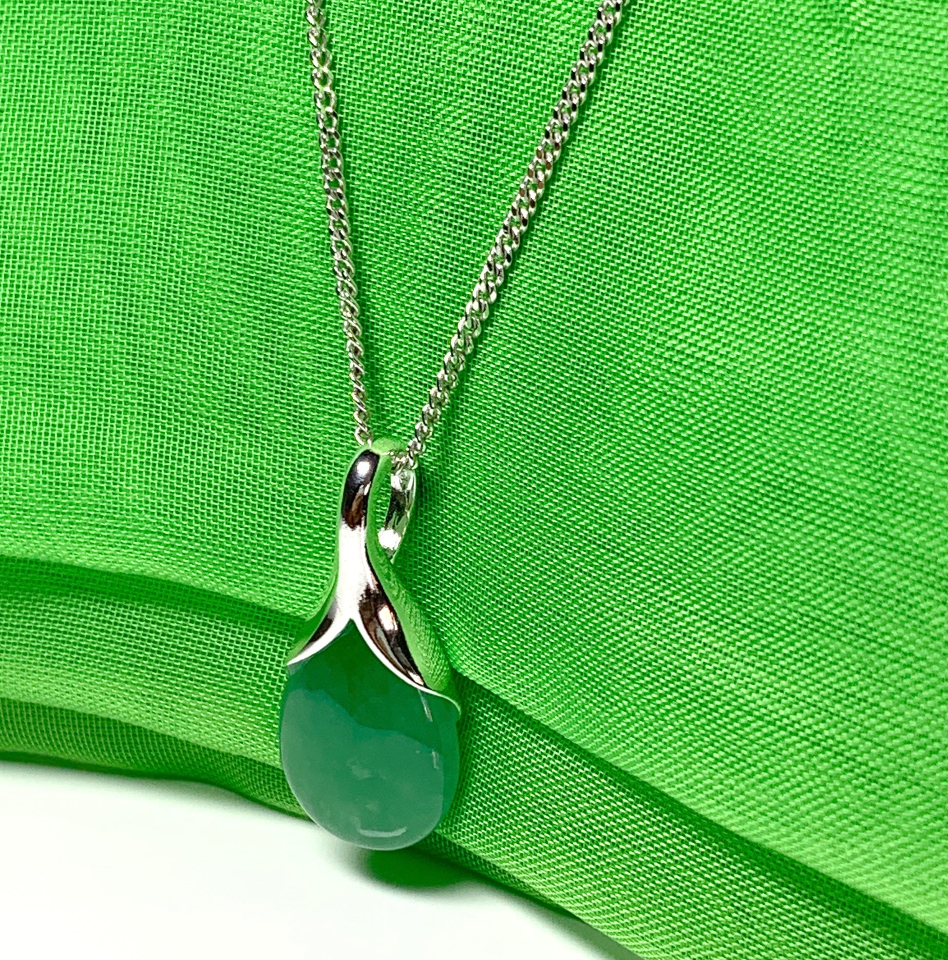 Real green jade necklace in a pear shaped sterling silver teardrop shape