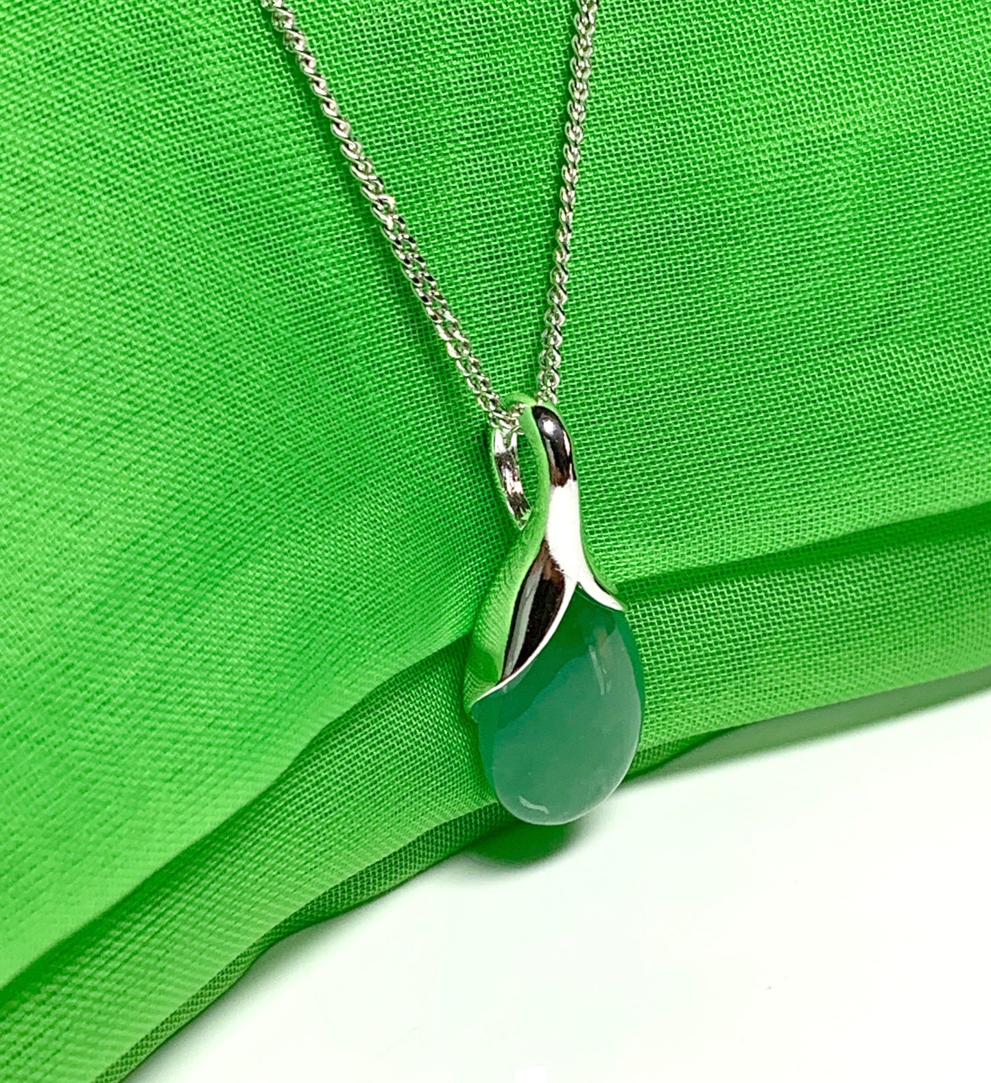 Real green jade necklace in a pear shaped sterling silver teardrop shape