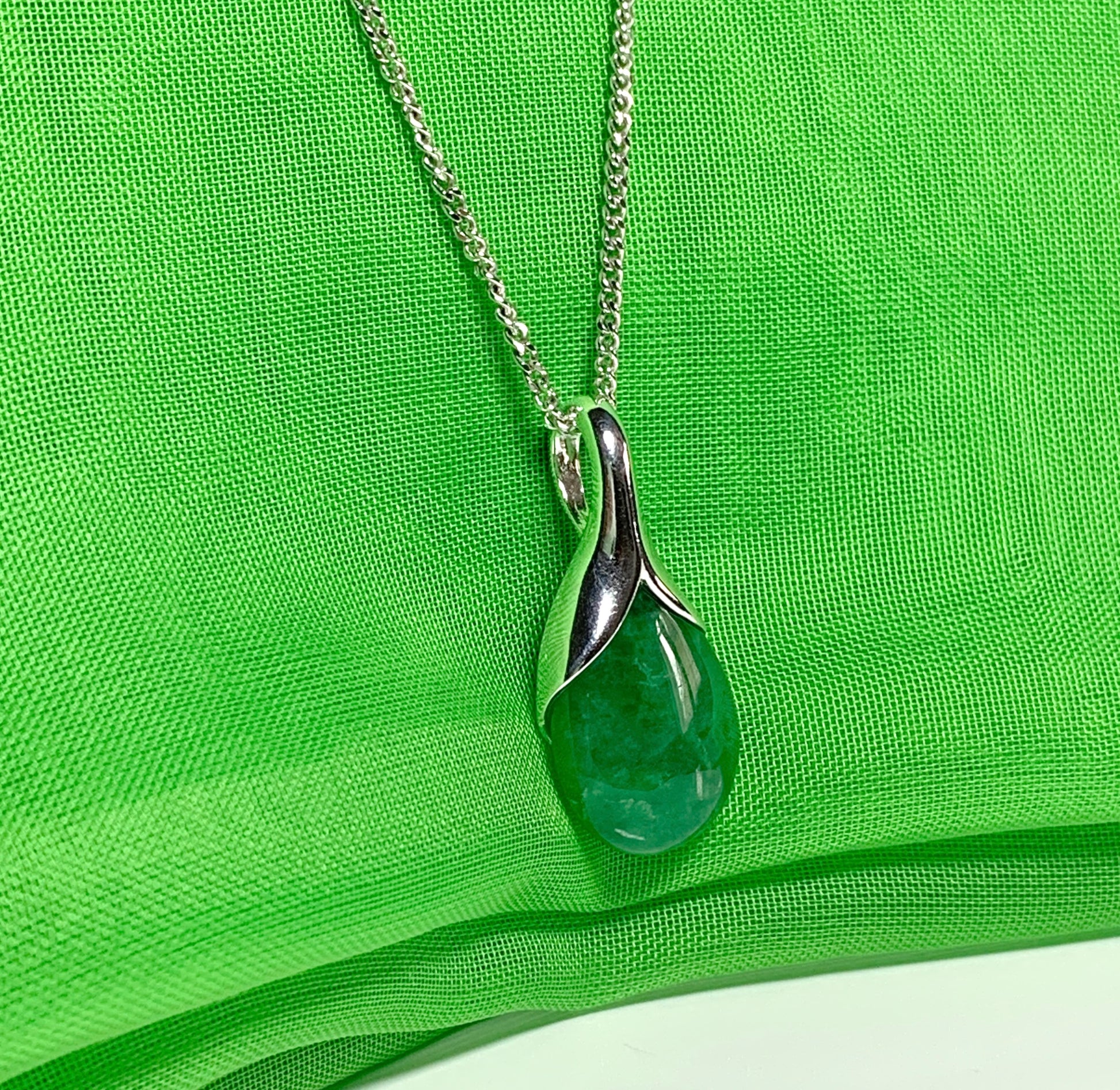 Real green jade necklace in a pear shaped sterling silver pendant Real green jade necklace in a pear shaped sterling silver pendant