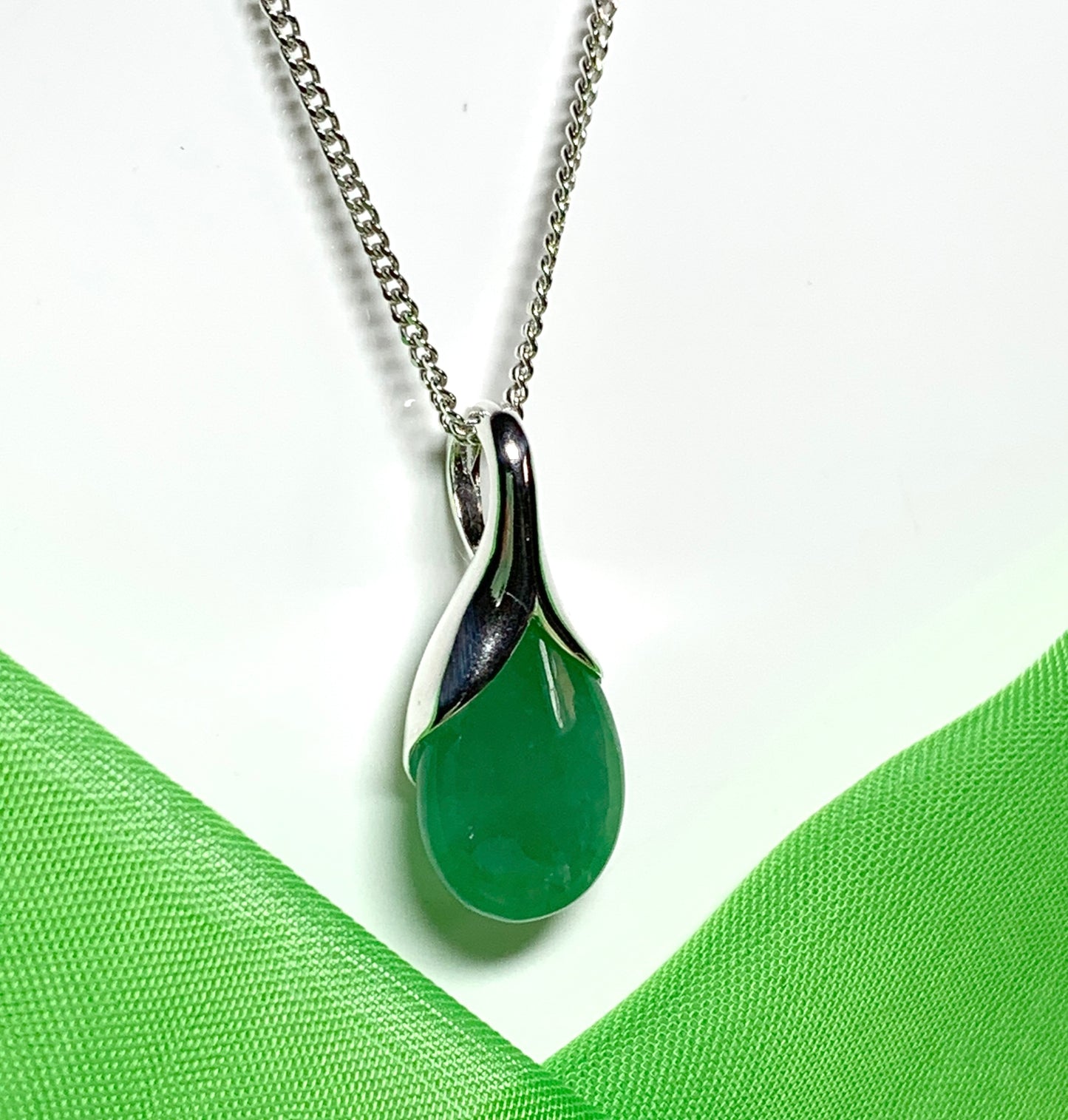 Real green jade necklace in a pear shaped sterling silver teardrop shape