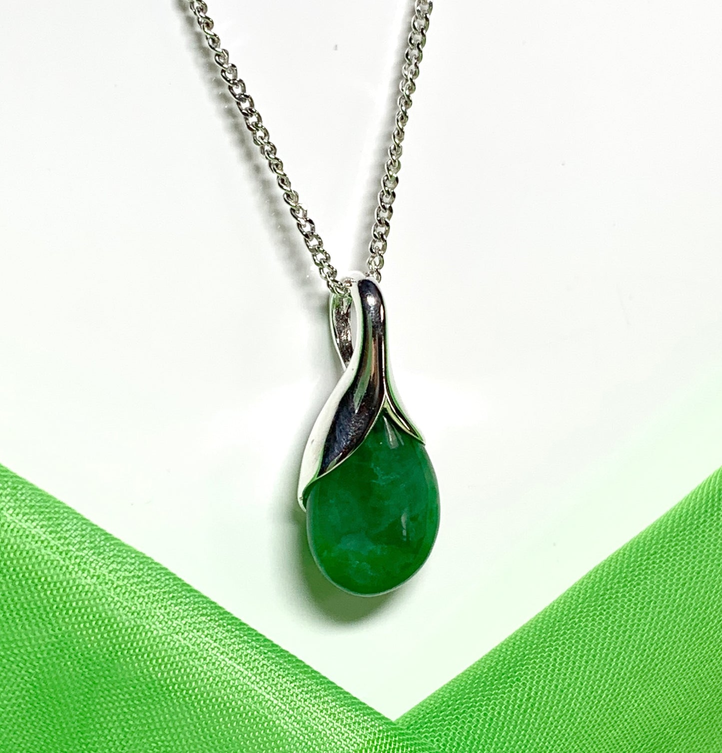 Real green jade necklace in a pear shaped sterling silver pendant