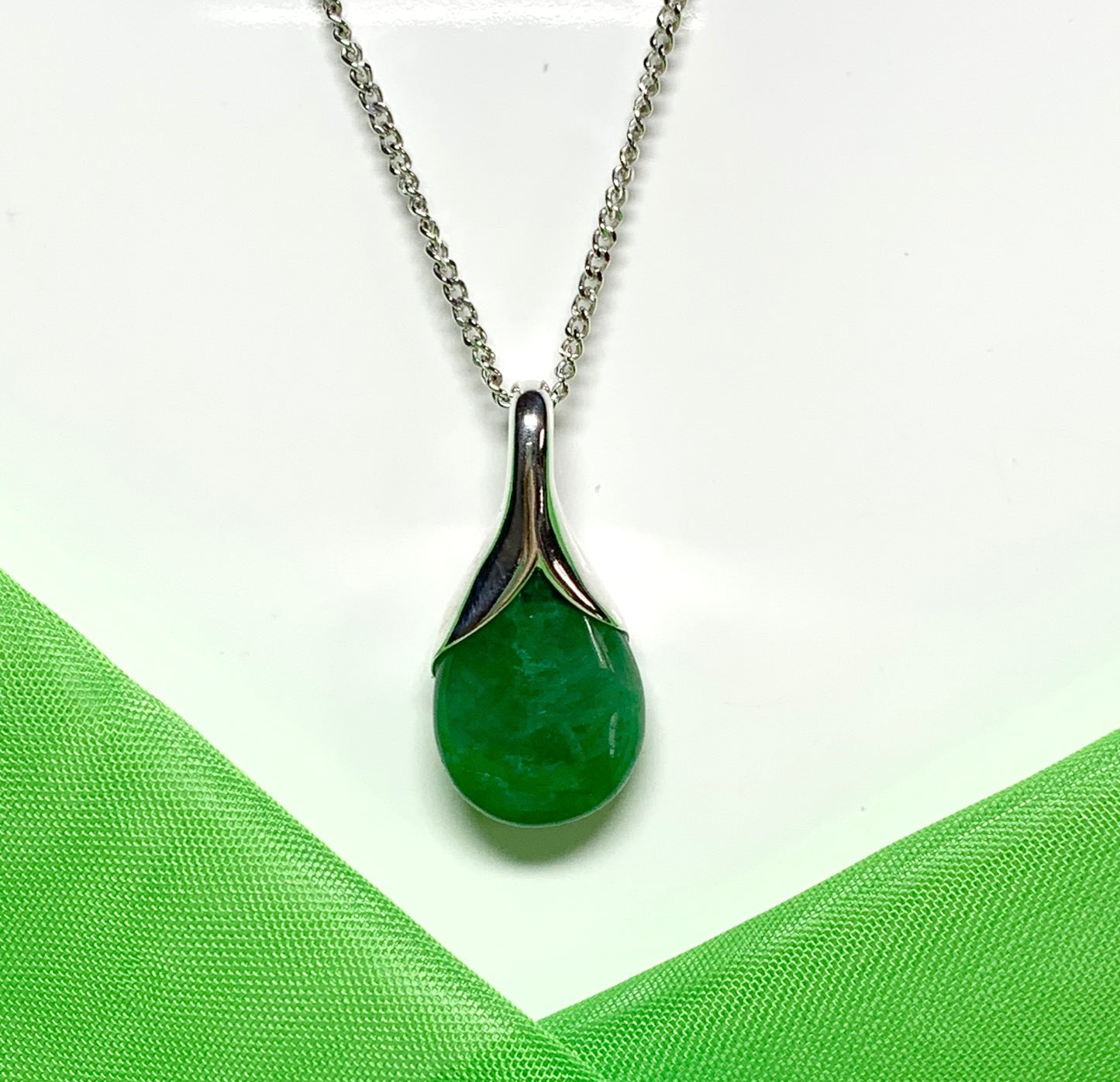 Real green jade necklace in a pear shaped sterling silver pendant