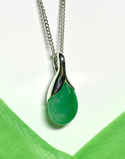 Real green jade necklace in a tear drop or pear shaped sterling silver pendant