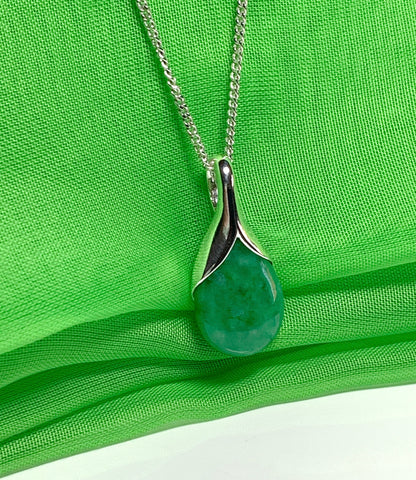 Real green jade necklace in a pear or tear drop shaped sterling silver pendant