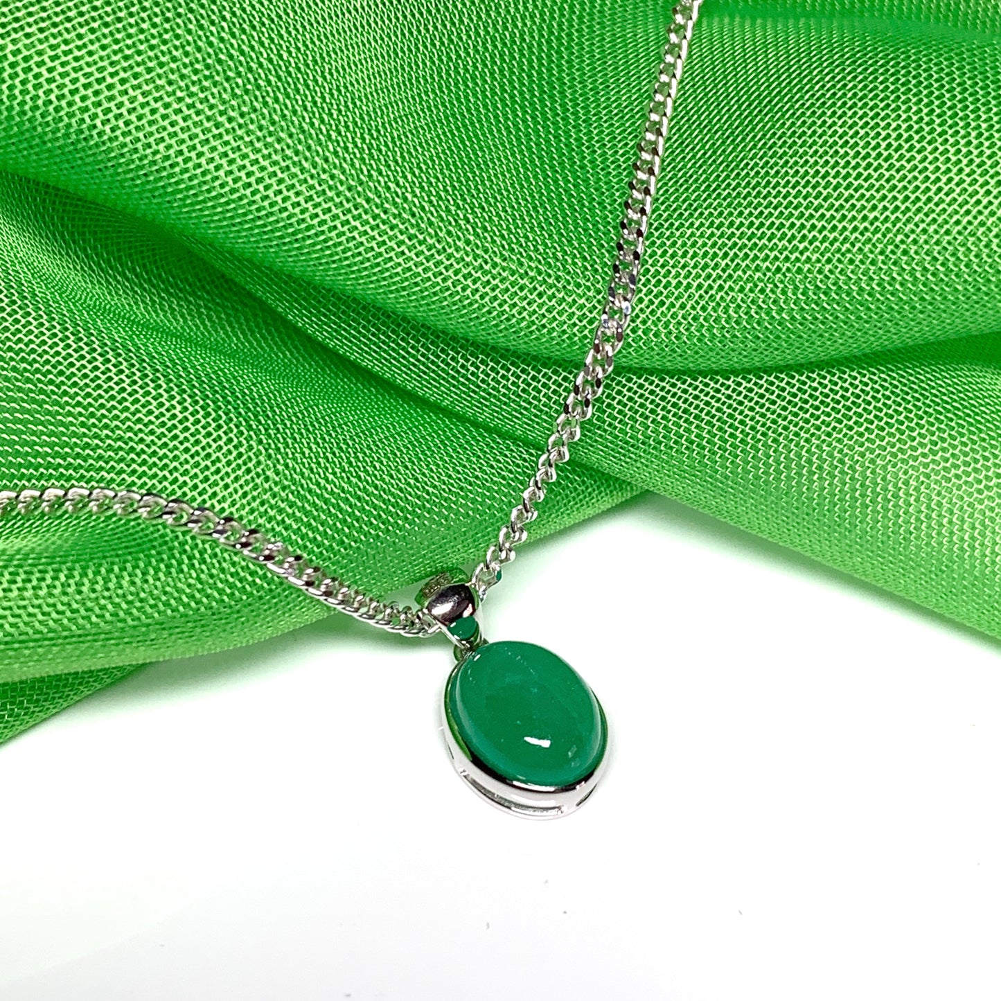 Real green jade necklace white gold oval rubbed over smooth setting