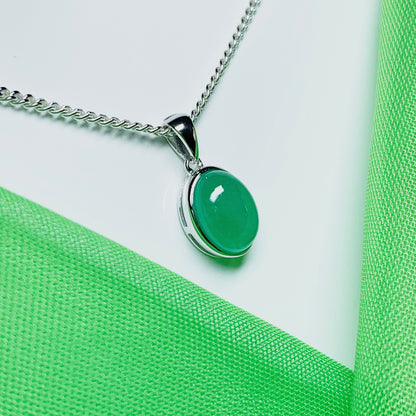 Real green jade necklace white gold oval rubbed over smooth setting