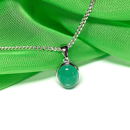 Real green jade necklace white gold oval rubbed over smooth setting