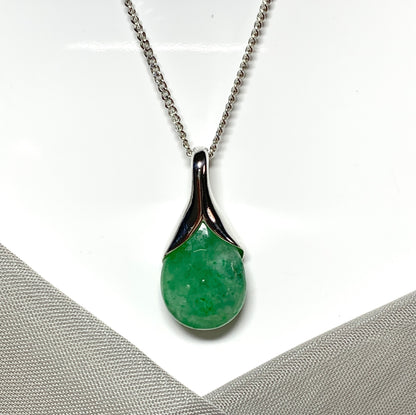 Real green jade pendant necklace in a teardrop shaped or pear shaped