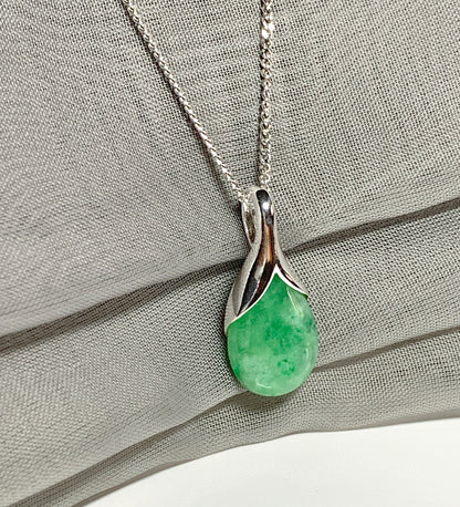 Real green jade pendant necklace in a teardrop shaped or pear shaped