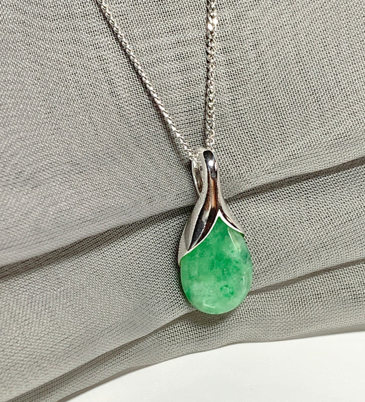 Real green jade pendant necklace in a teardrop shaped or pear shaped