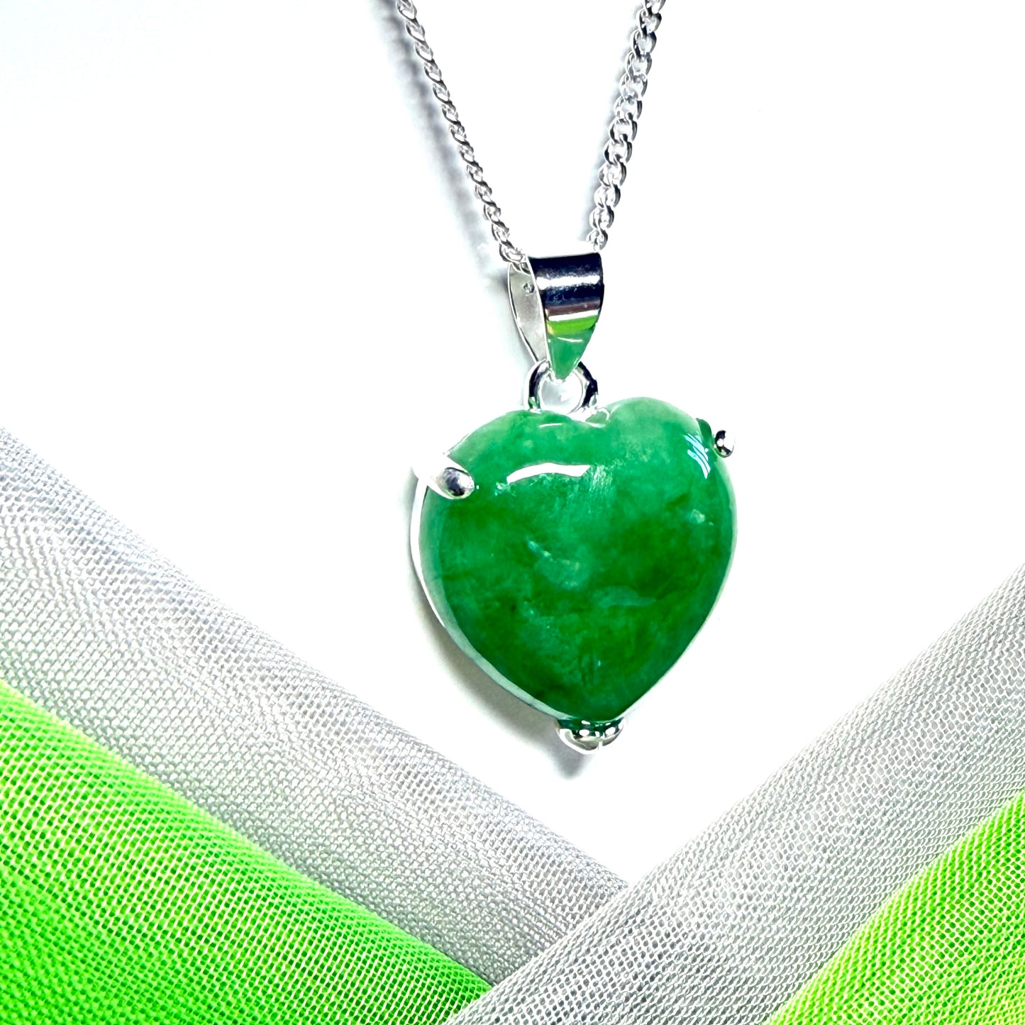 A really beautiful pendant real green jade necklace heart shaped sterling silver with a solid chain