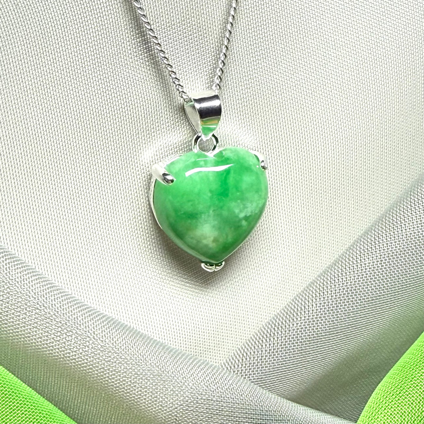 A really stunning pendant with a real green jade necklace heart shaped sterling silver