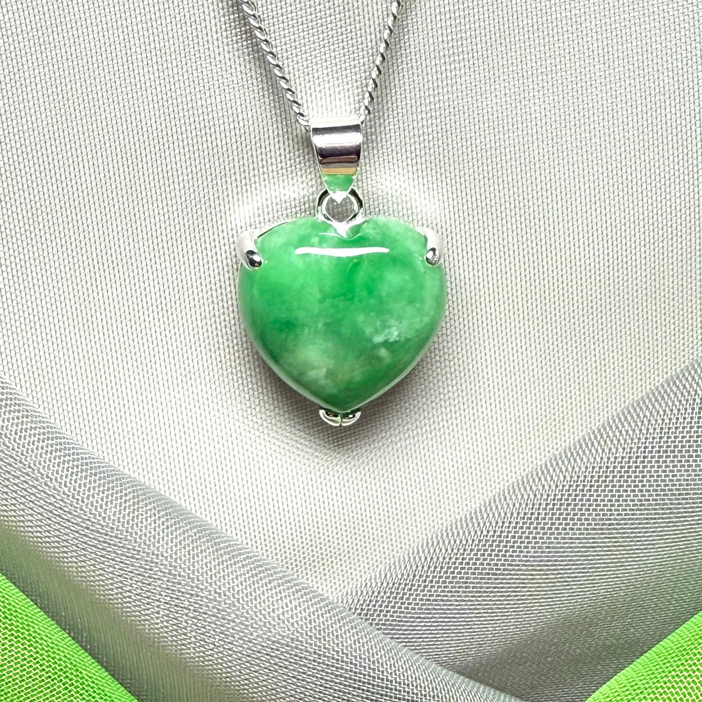 A really stunning pendant with a real green jade necklace heart shaped sterling silver