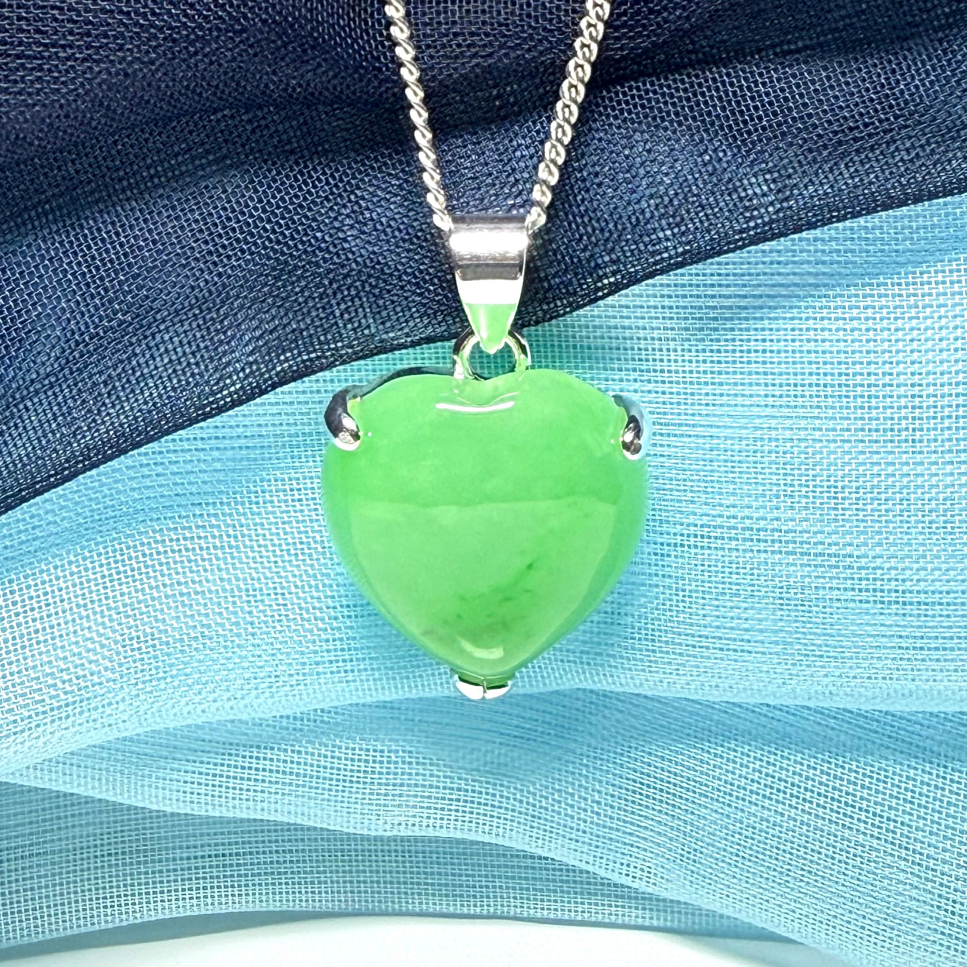 A really stunning real green jade necklace heart shaped sterling silver with chain included as well