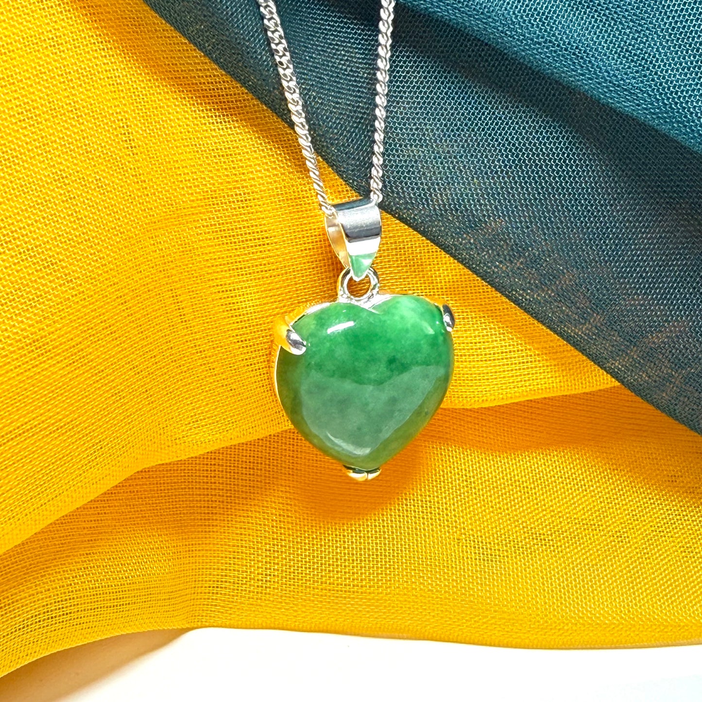 A really stunning real green jade necklace heart shaped sterling silver with a curb chain included as well