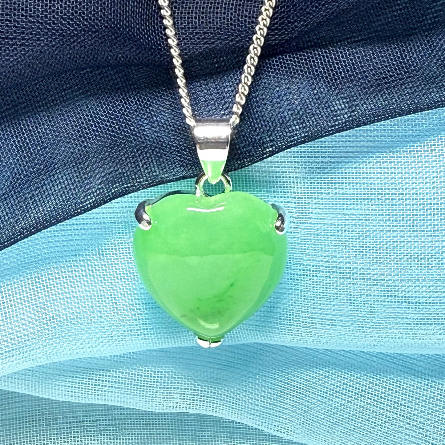 A really stunning real green jade necklace heart shaped sterling silver with chain included as well