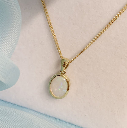 Real opal necklace yellow gold oval pendant smooth rubbed over setting