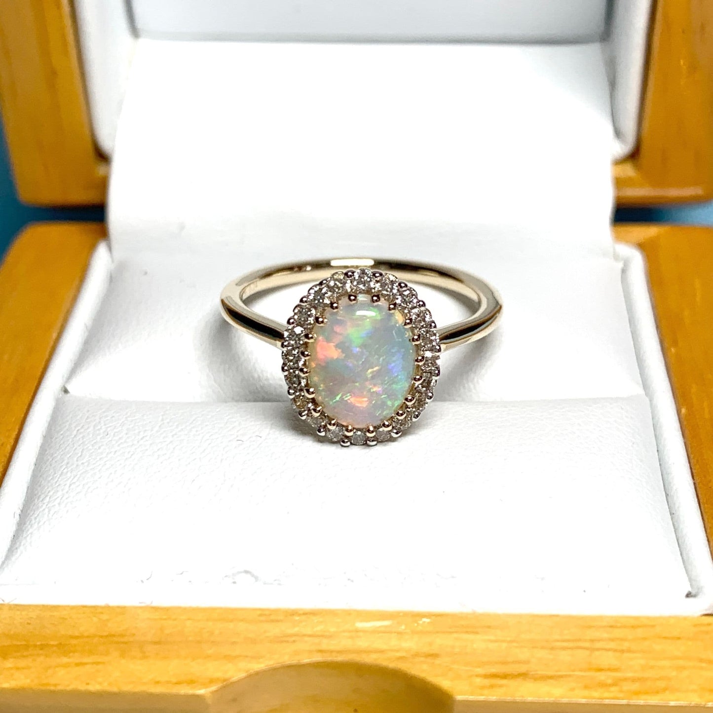 Opal oval and diamond yellow gold cluster ring