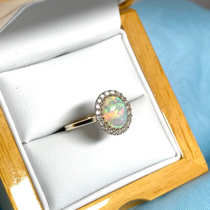 Opal oval and diamond yellow gold cluster ring