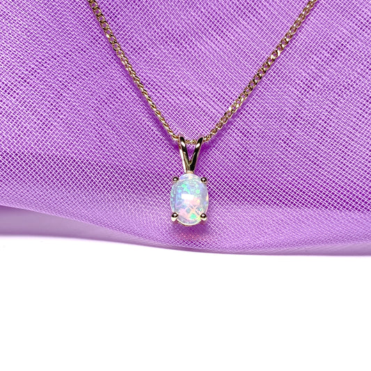 Real opal pendant oval yellow gold