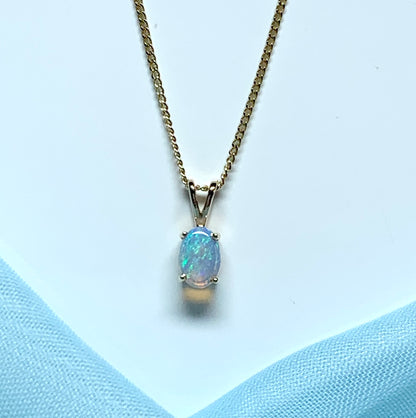 Real opal pendant oval cut yellow gold