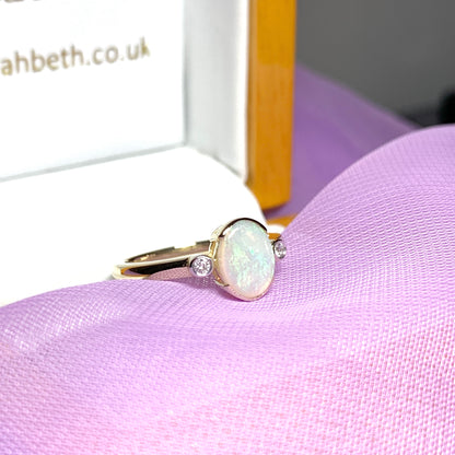 Real opal ring with diamond oval yellow gold