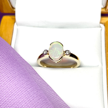 Real opal ring with diamond oval yellow gold