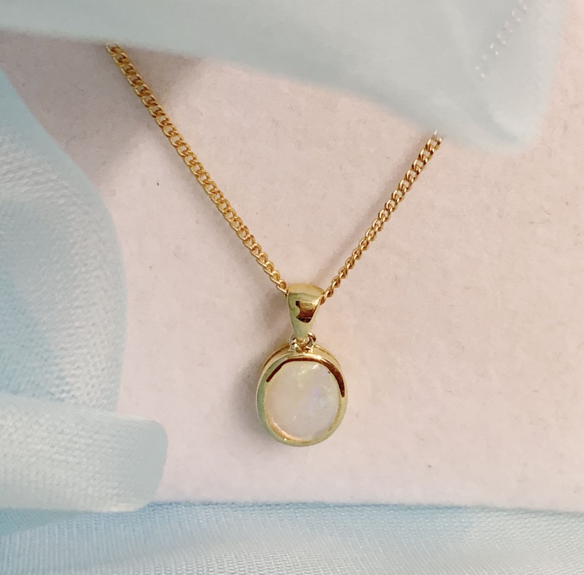 Real opal necklace yellow gold oval pendant smooth rubbed over setting