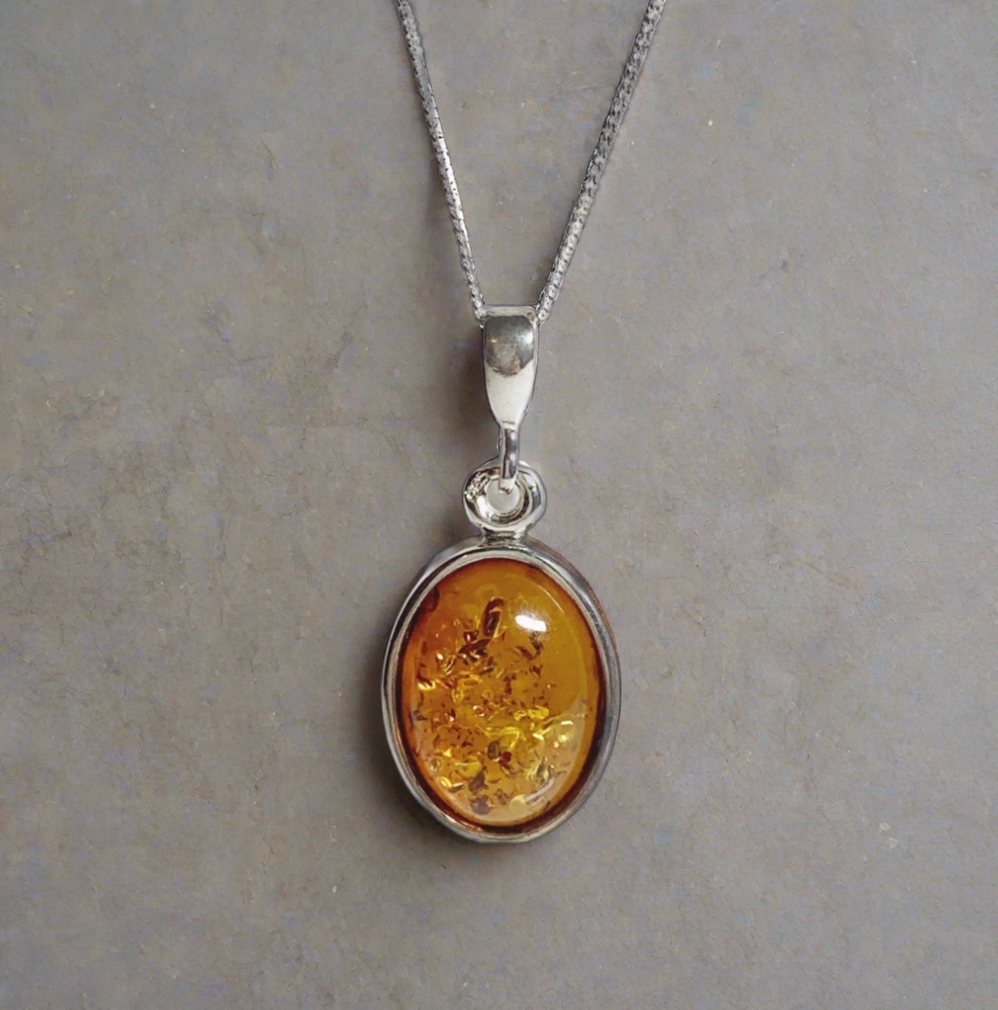 Orange amber oval sterling silver necklace