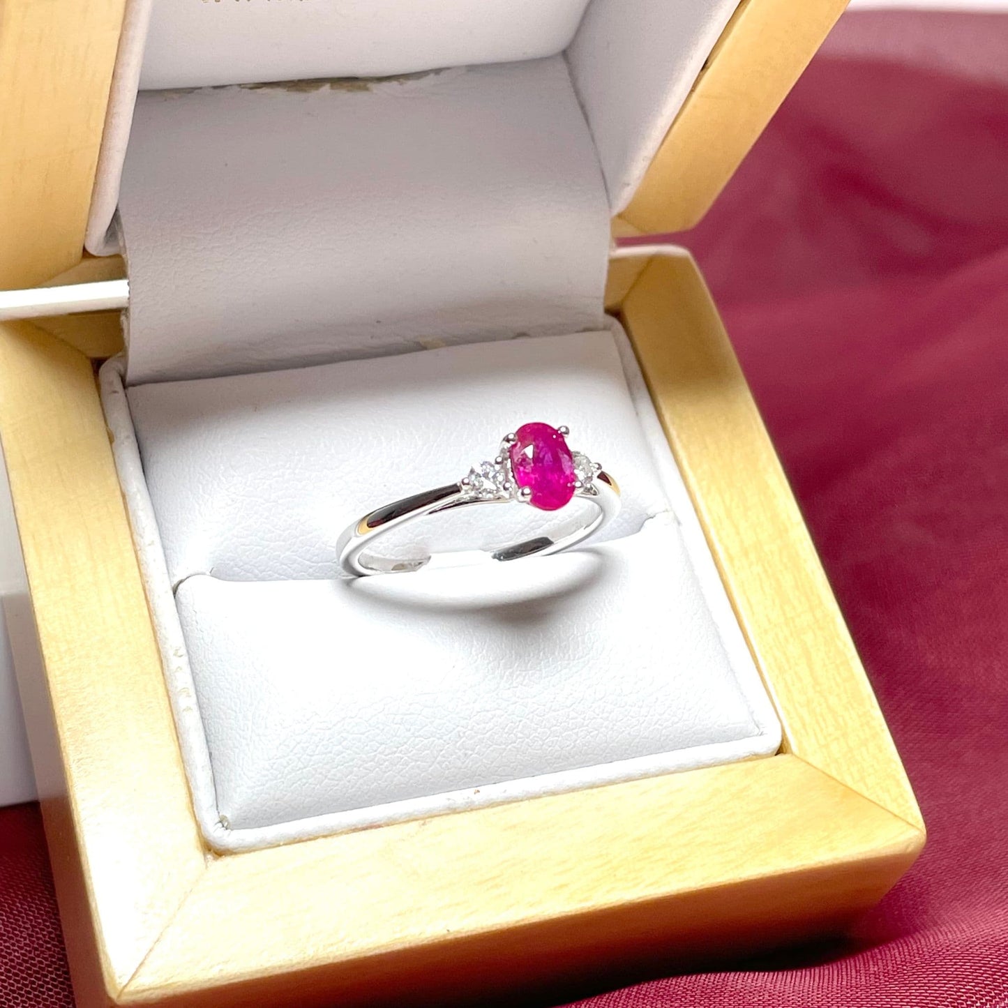 Oval ruby red and diamond white gold dress ring