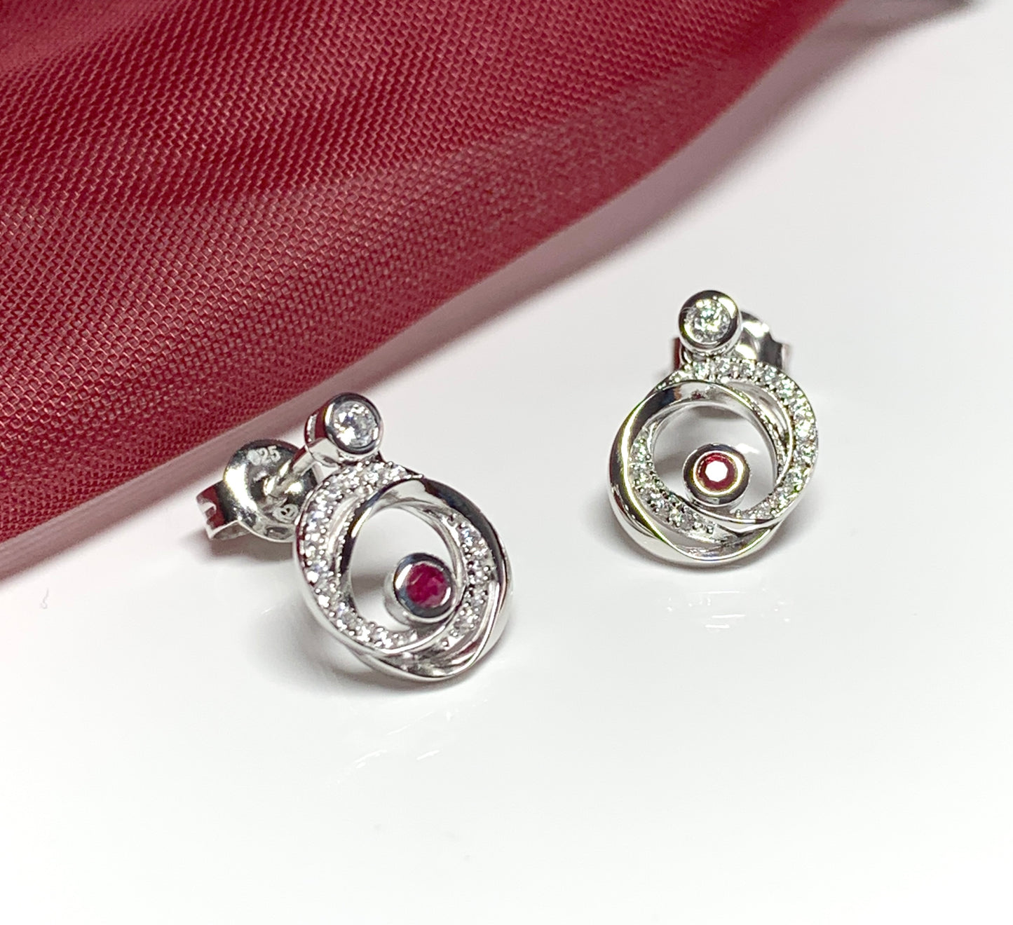 Real red ruby and cubic zirconia round swirl stud earrings