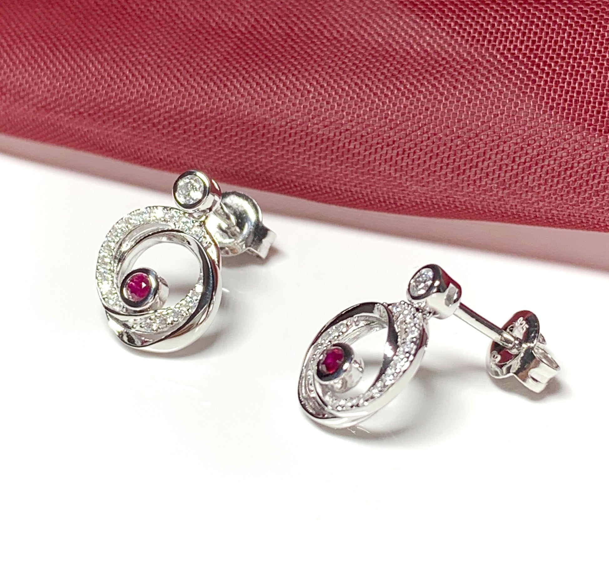 Real red ruby and cubic zirconia round swirl stud earrings