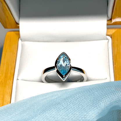 Real blue topaz ladies marquise shaped dress ring