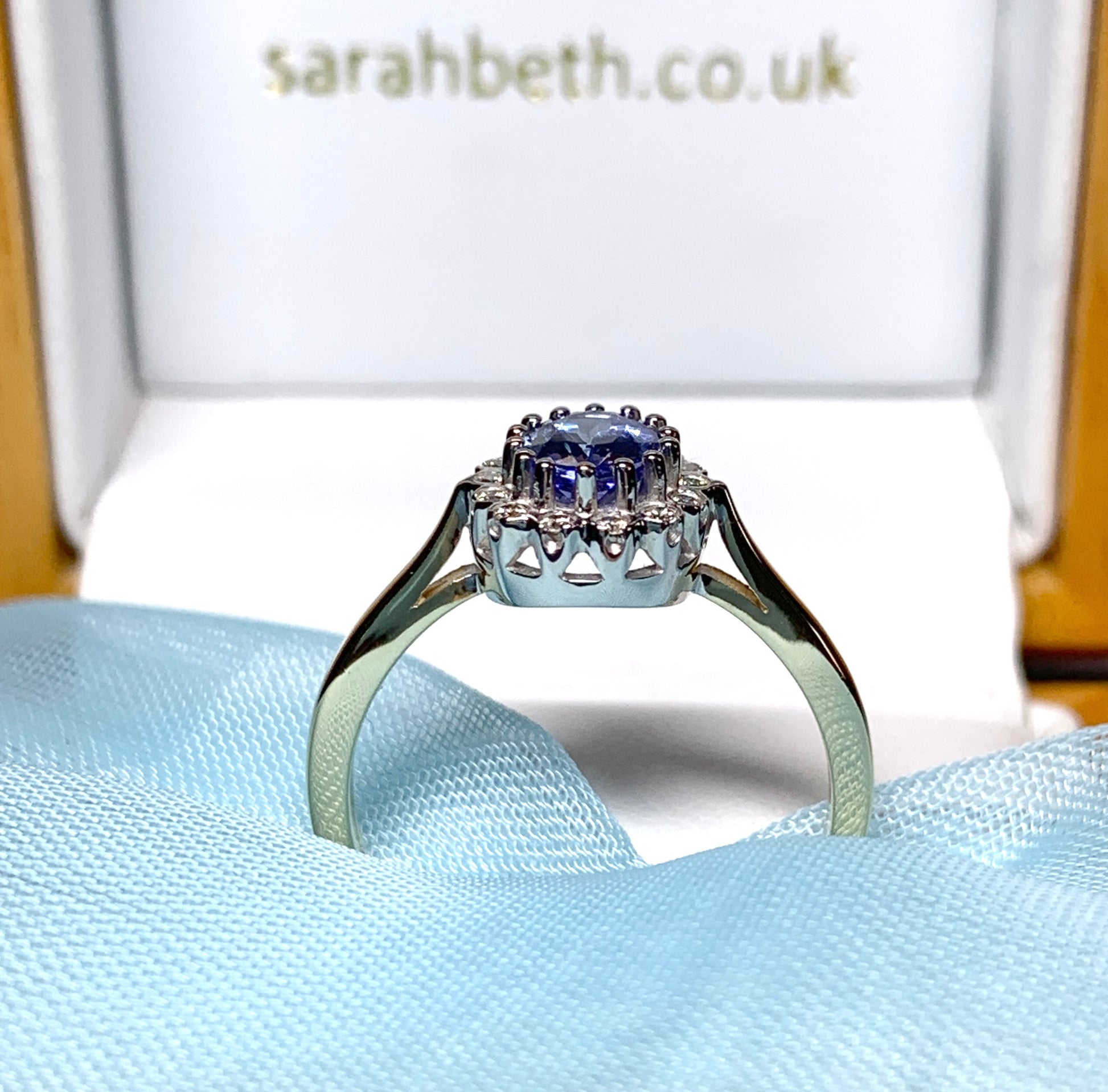 Oval real tanzanite and diamond cluster ring yellow gold