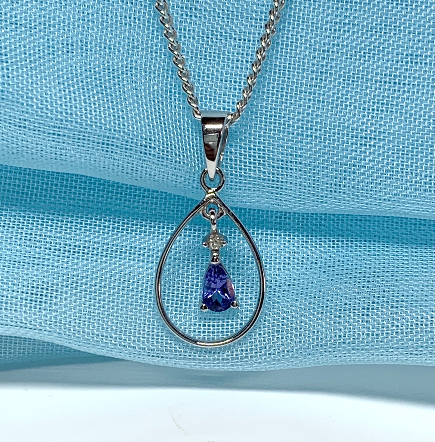 Real tanzanite and diamond necklace white gold open pear shaped