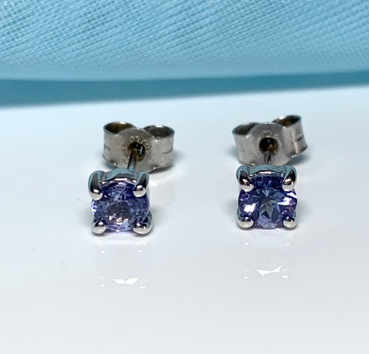 Real tanzanite round white gold round stud earrings