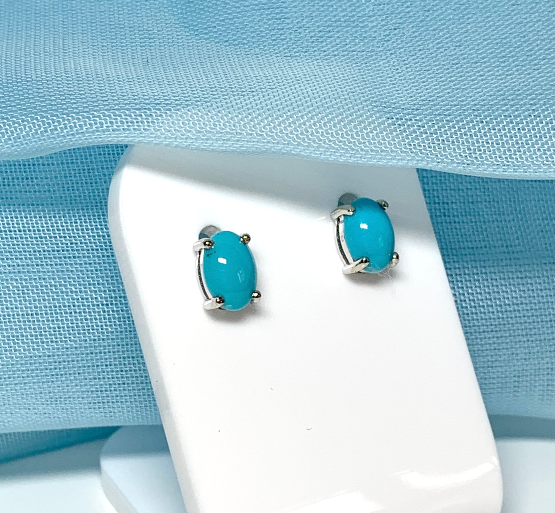 Real turquoise stud earrings oval white gold