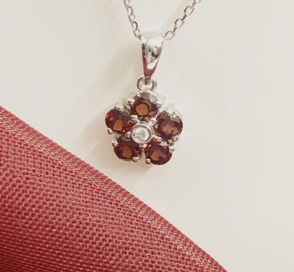 Red brown garnet and diamond white gold daisy cluster necklace pendant