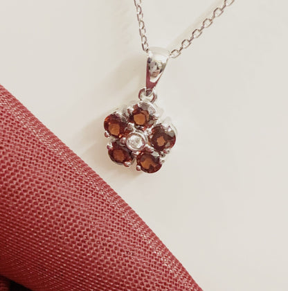 Red brown garnet and diamond white gold daisy cluster necklace pendant