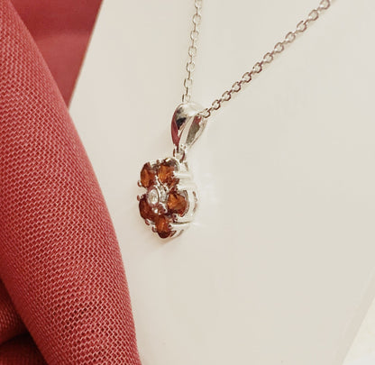 Red brown garnet and diamond white gold daisy cluster necklace pendant