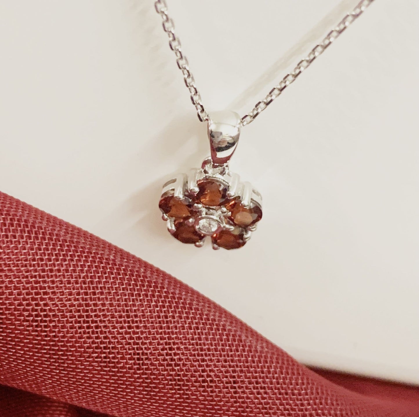 Red brown garnet and diamond white gold daisy cluster necklace pendant